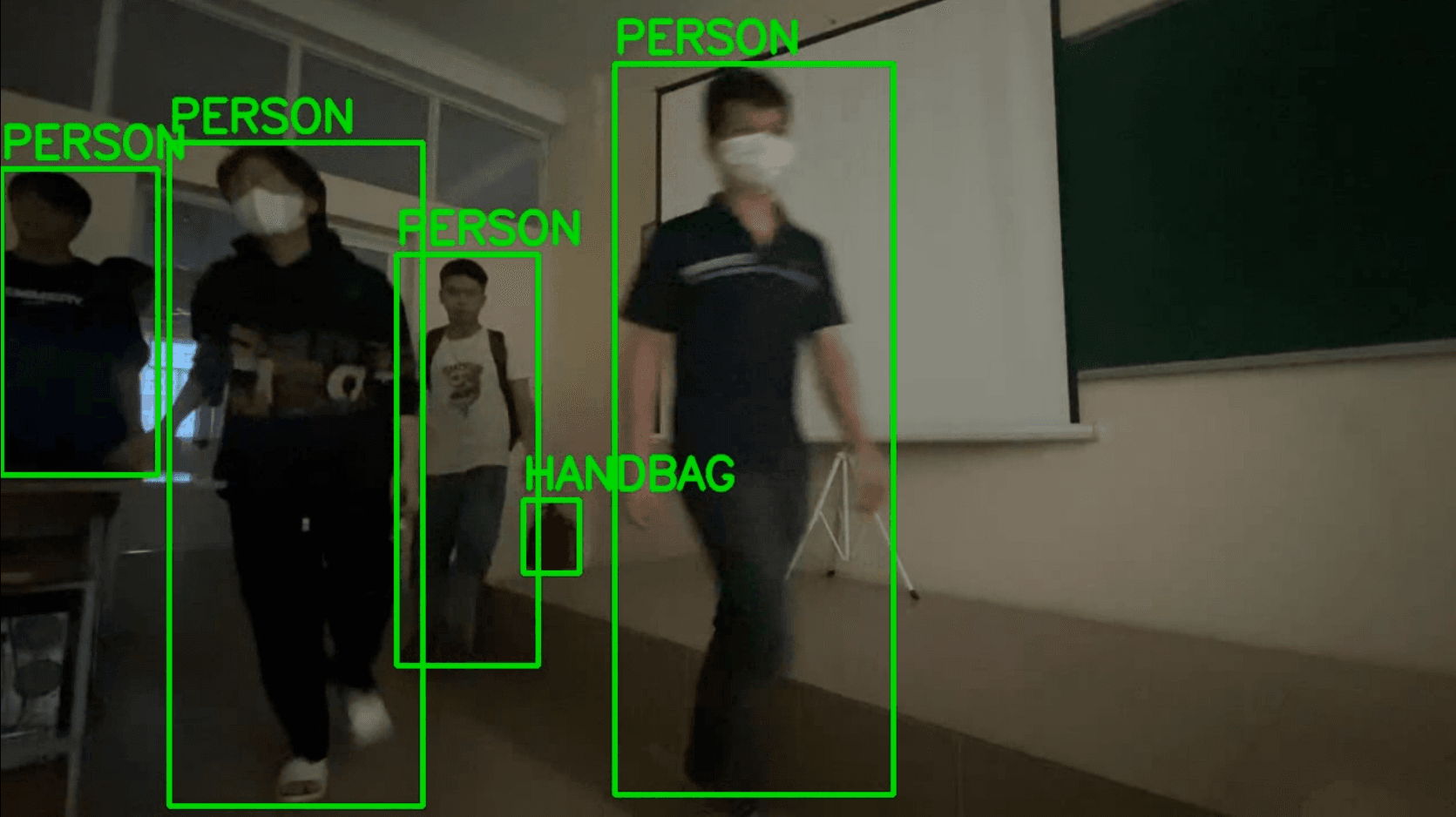 Classroom CCTV frame with students boxed and labelled as person